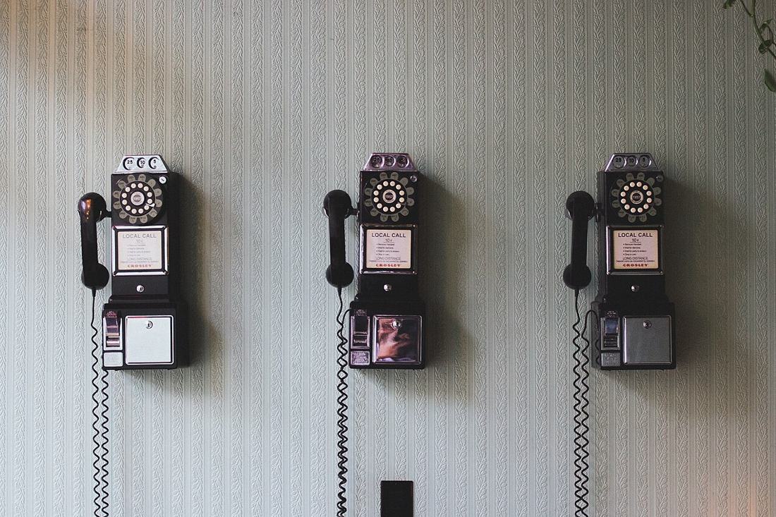 Vintage telephones on a wall